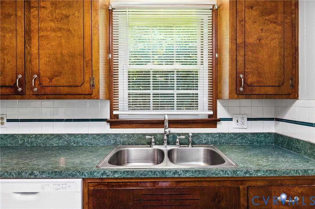 2111 Clary Road Petersburg, VA 23805 - Photo 20 of 47 a kitchen with granite countertop a sink and a window