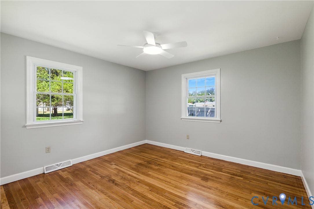 2111 Clary Road Petersburg, VA 23805 - Photo 30 of 47 a view of an empty room with wooden floor and a window