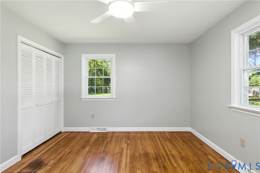2111 Clary Road Petersburg, VA 23805 - Photo 31 of 47 an empty room with wooden floor and windows