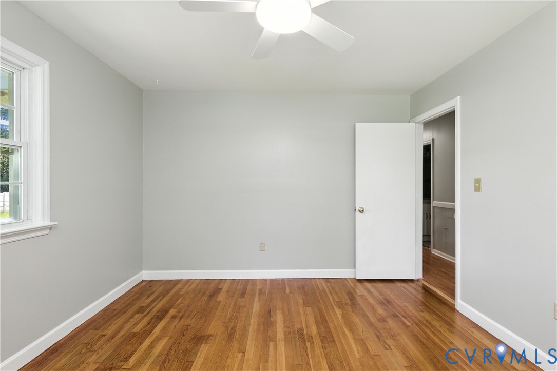 2111 Clary Road Petersburg, VA 23805 - Photo 33 of 47 an empty room with wooden floor and windows
