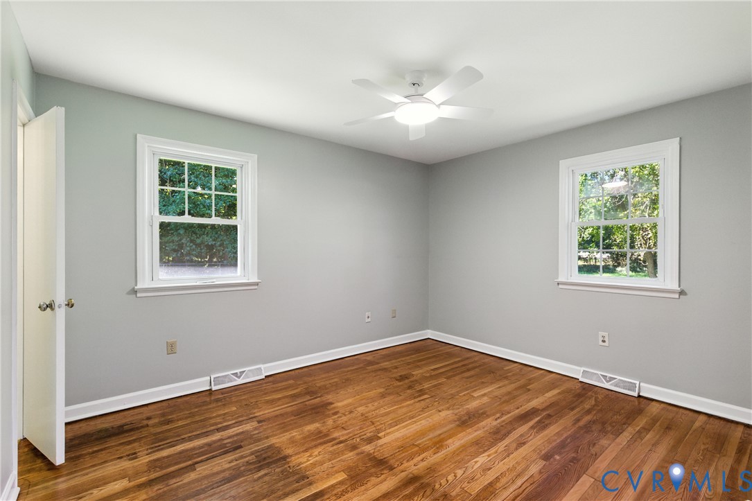 2111 Clary Road Petersburg, VA 23805 - Photo 34 of 47 a view of an empty room with wooden floor and a window