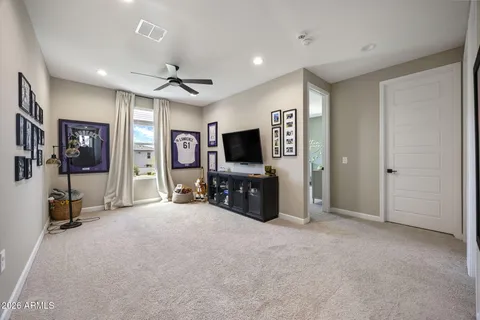a view of a livingroom with a flat screen tv and outdoor space