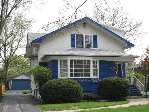 309 Shenstone Road Riverside, IL 60546 - Photo 1 of 1 a front view of a house with a garden