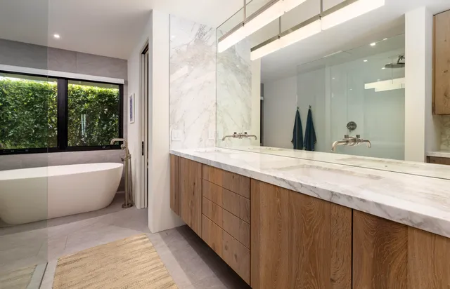 a spacious bathroom with a large tub and sink
