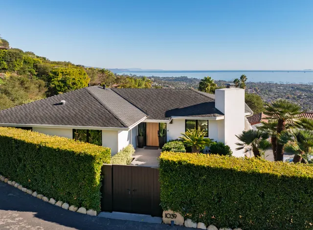 an aerial view of a house with a garden