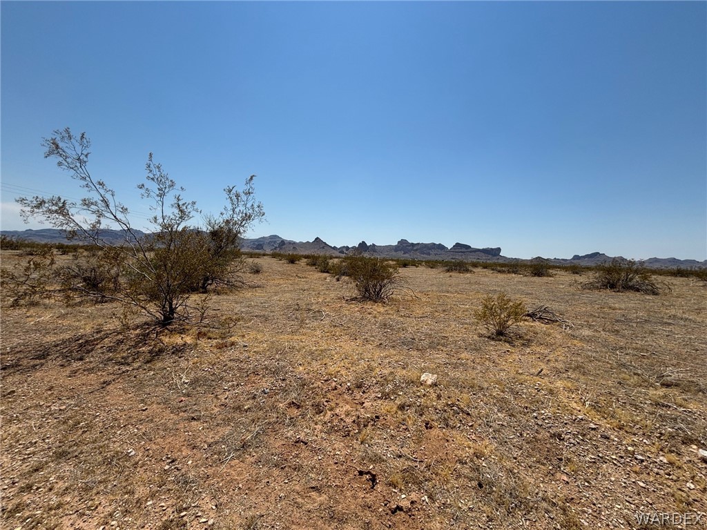 2161 Cowlic Road Golden Valley, AZ 86413 - Photo 10 of 12 a view of a lake with mountain in the background