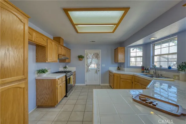 a kitchen with kitchen island granite countertop lots of counter top space