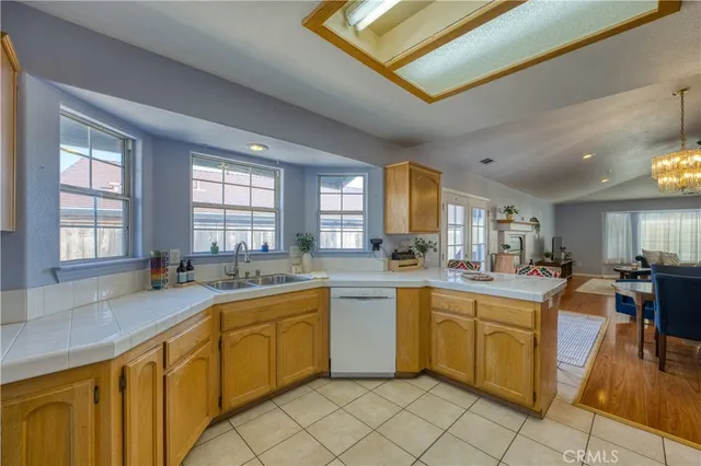 a kitchen with lots of counter top space and living room