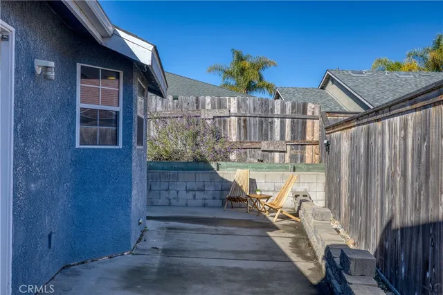 a view of a pathway of a house with flower plants