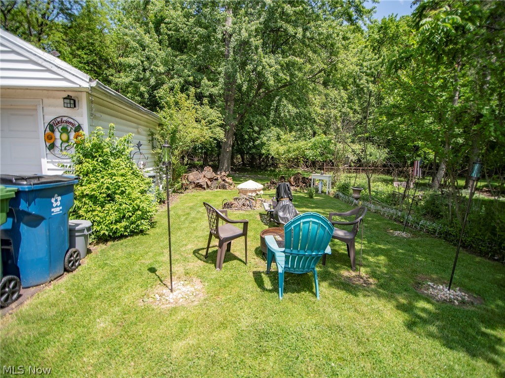 9438 Stonington Road Parma Heights, OH 44130 - Photo 26 of 27 fire pit area overlooking the woods