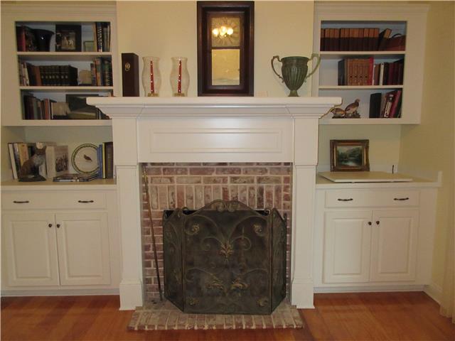 259 Hopkins Road Pulaski, TN 38478 - Photo 14 of 20 Living room with masonry fireplace flanked with matching bookcases