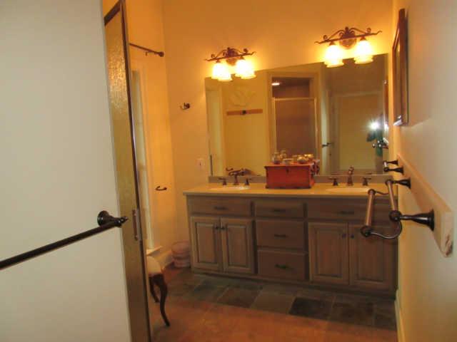 259 Hopkins Road Pulaski, TN 38478 - Photo 18 of 20 Master Bathroom with double vanities and slate floor