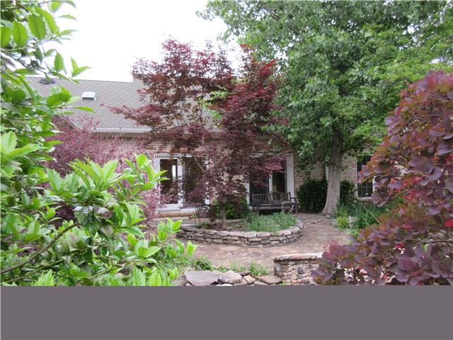 259 Hopkins Road Pulaski, TN 38478 - Photo 7 of 20 Stone patio with Koi pond and bridge