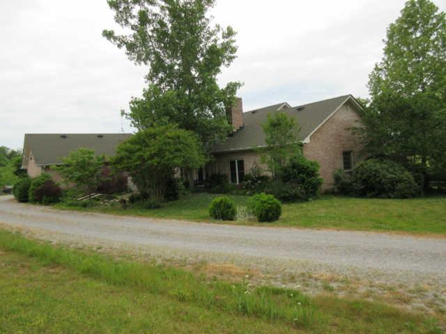 259 Hopkins Road Pulaski, TN 38478 - Photo 8 of 20 Back of house with mature landscaping and circular driveway