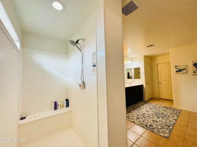 a bathroom with a bathtub and a shower