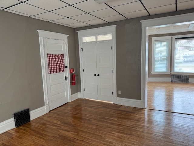 43 West Church Street, Unit 100 Sandwich, IL 60548 - Photo 13 of 22 a view of wooden floor in an empty room with a window