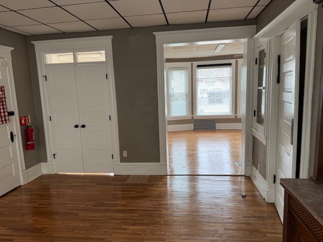 43 West Church Street, Unit 100 Sandwich, IL 60548 - Photo 15 of 22 a view of empty room with wooden floor and fan