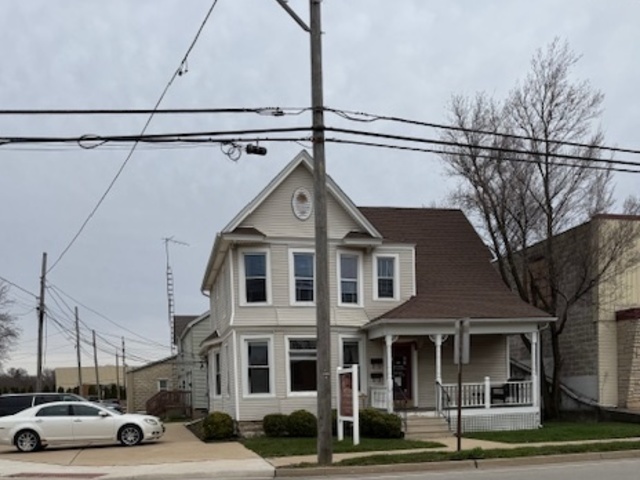43 West Church Street, Unit 100 Sandwich, IL 60548 - Photo 21 of 22 a view of a car parked in front of a building