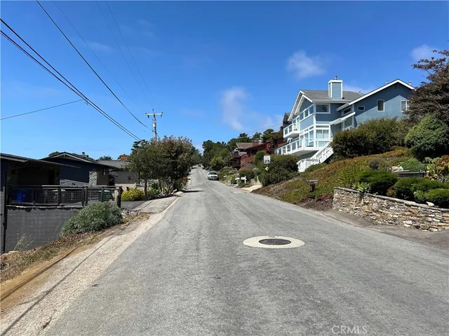 a view of a street with a houses