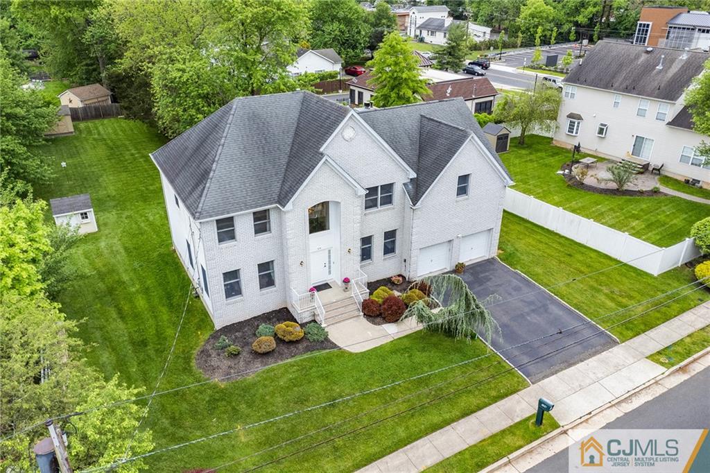 an aerial view of a house with a garden