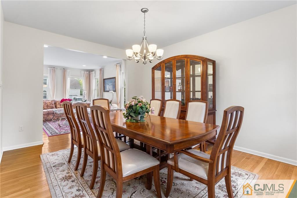104 Mundy Avenue Edison, NJ 08820 - Photo 11 of 55 a view of a dining room with furniture window and wooden floor
