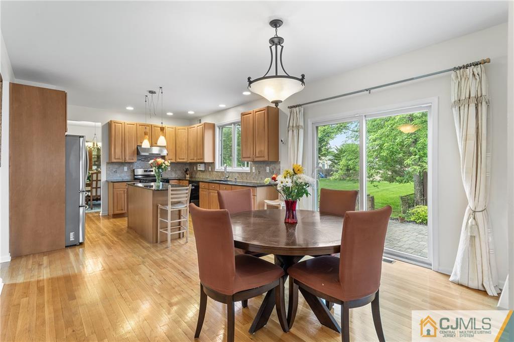 104 Mundy Avenue Edison, NJ 08820 - Photo 13 of 55 a dining room with furniture a chandelier and window