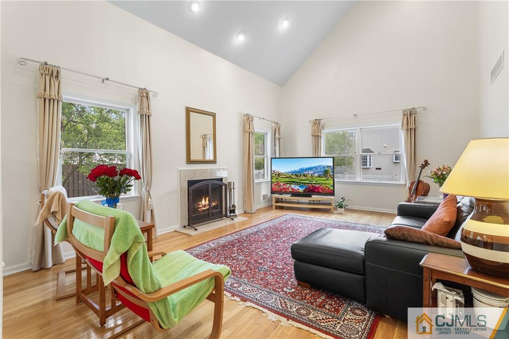 104 Mundy Avenue Edison, NJ 08820 - Photo 17 of 55 a living room with furniture a window and a fireplace
