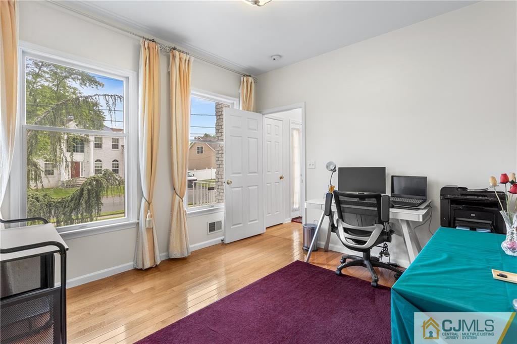 104 Mundy Avenue Edison, NJ 08820 - Photo 19 of 55 a view of a workspace with furniture and a window