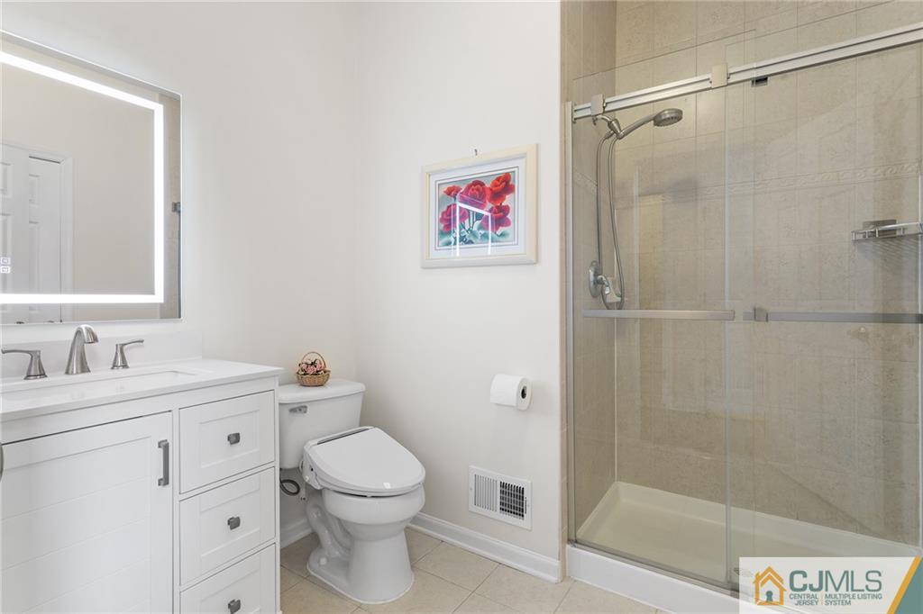 104 Mundy Avenue Edison, NJ 08820 - Photo 20 of 55 a bathroom with a sink a toilet and shower