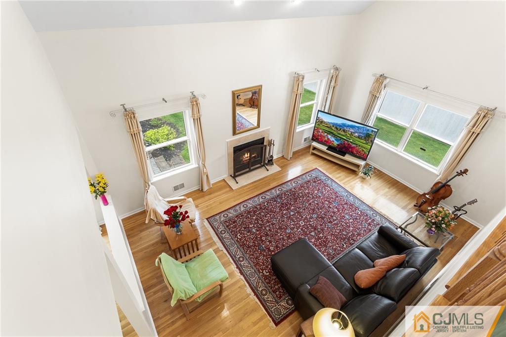 104 Mundy Avenue Edison, NJ 08820 - Photo 22 of 55 a living room with furniture and a flat screen tv
