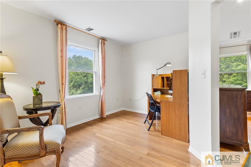 104 Mundy Avenue Edison, NJ 08820 - Photo 25 of 55 a view of a workspace with furniture and a window