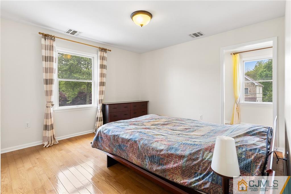 104 Mundy Avenue Edison, NJ 08820 - Photo 30 of 55 a bedroom with a bed window and a window