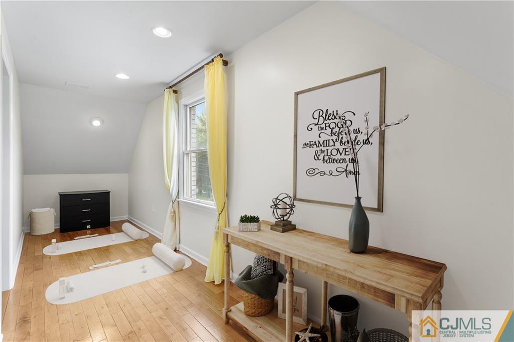 104 Mundy Avenue Edison, NJ 08820 - Photo 31 of 55 a living room with furniture and a flat screen tv