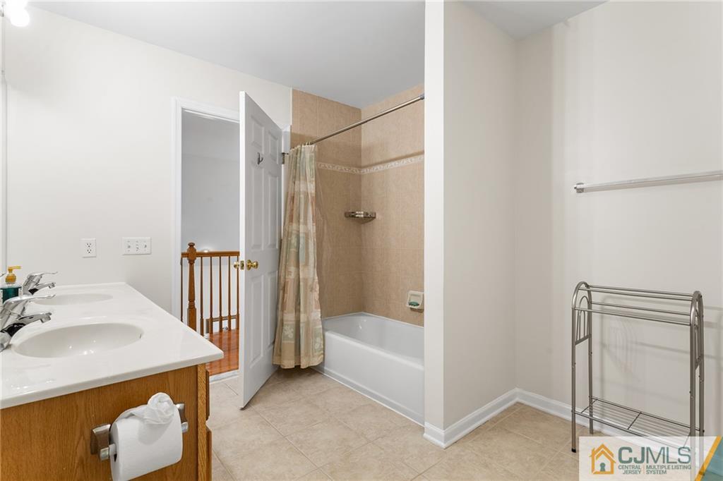 104 Mundy Avenue Edison, NJ 08820 - Photo 33 of 55 a bathroom with a tub and shower
