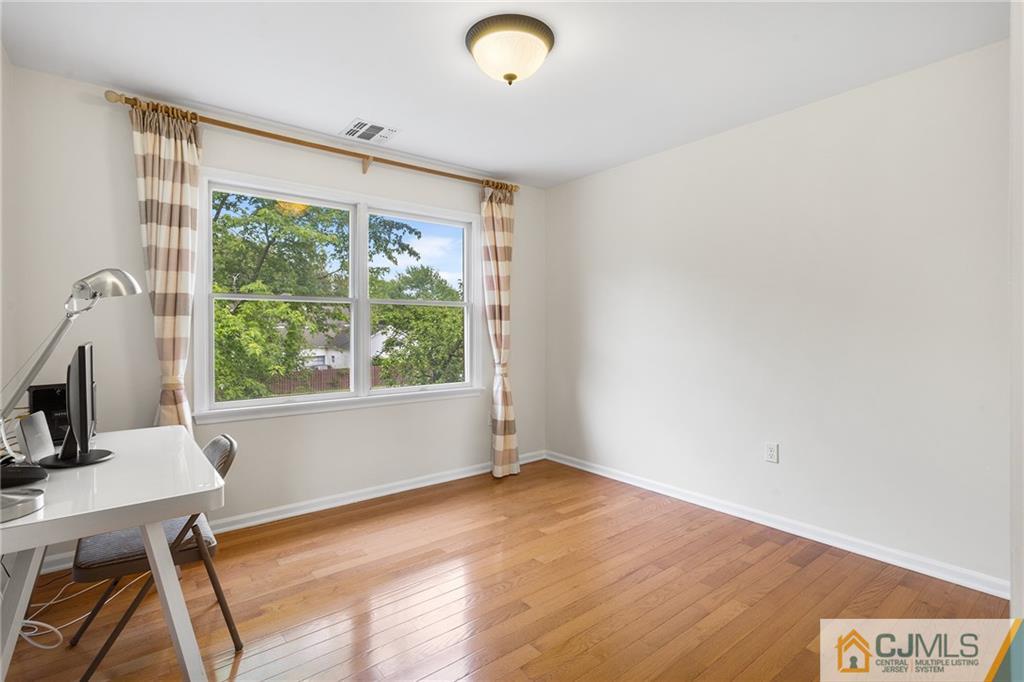 104 Mundy Avenue Edison, NJ 08820 - Photo 35 of 55 a view of a workspace with furniture and a window