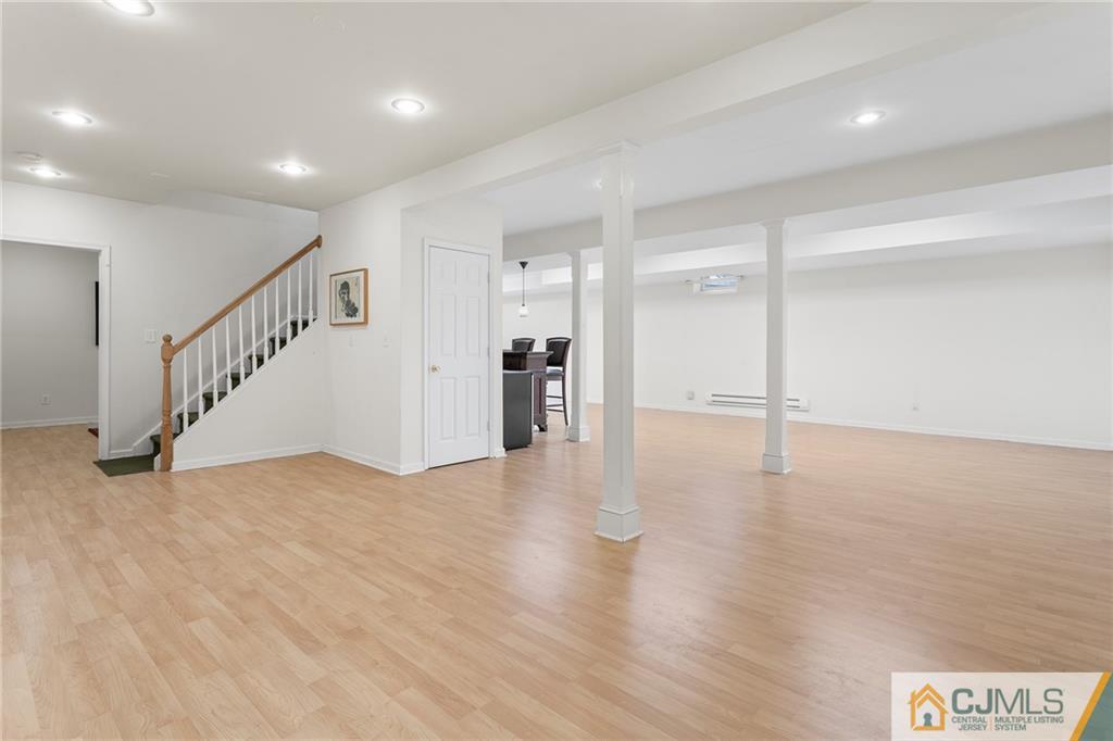 104 Mundy Avenue Edison, NJ 08820 - Photo 37 of 55 a view of an empty room with wooden floor
