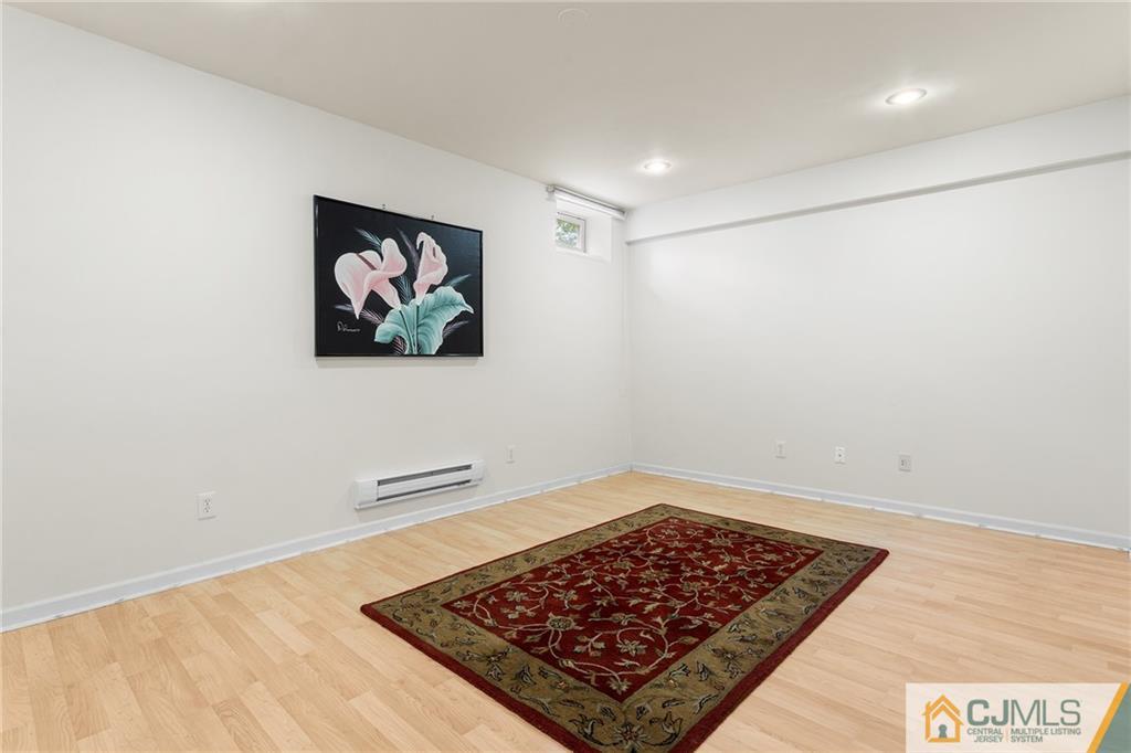 104 Mundy Avenue Edison, NJ 08820 - Photo 40 of 55 an empty room with a rug
