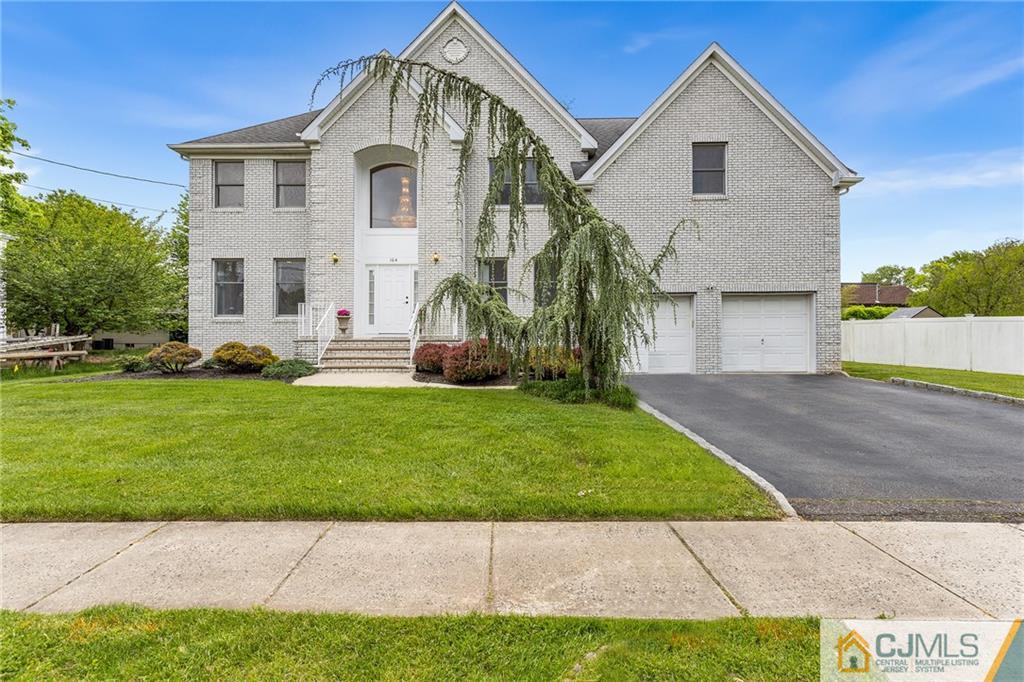 104 Mundy Avenue Edison, NJ 08820 - Photo 4 of 55 a front view of a house with a garden
