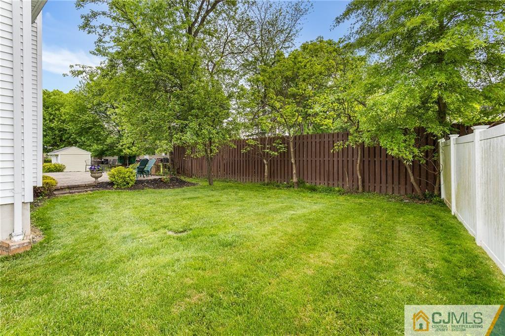 104 Mundy Avenue Edison, NJ 08820 - Photo 46 of 55 a backyard of a house with lots of green space