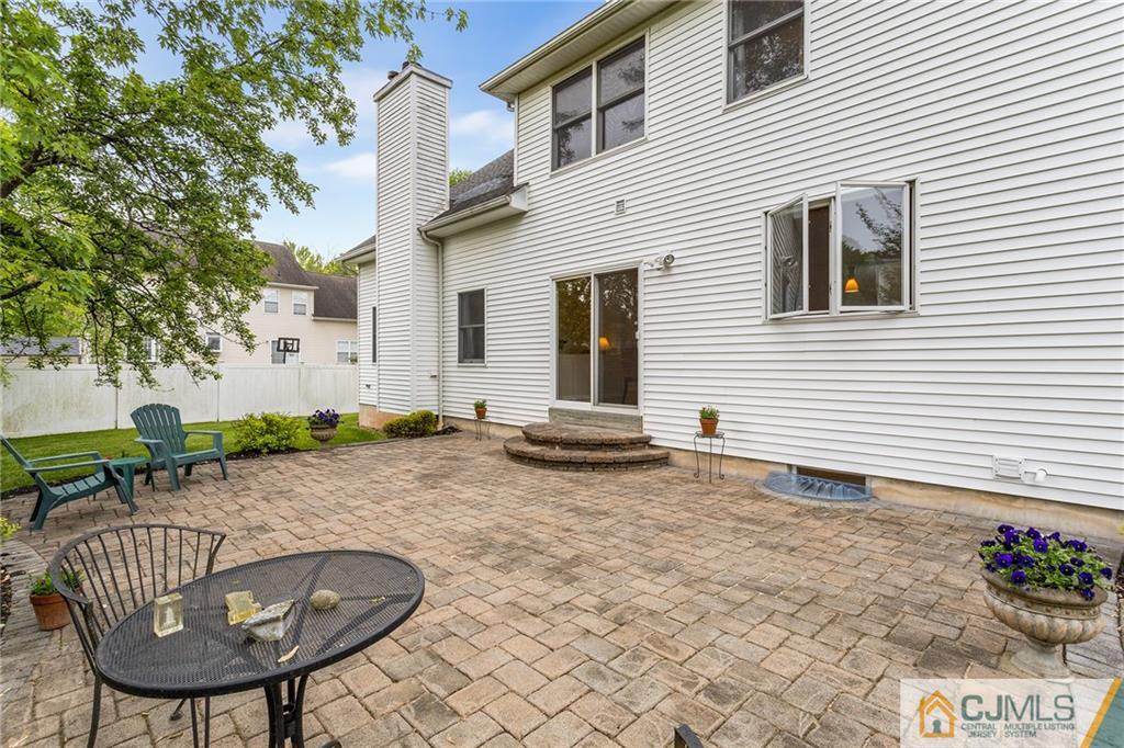 104 Mundy Avenue Edison, NJ 08820 - Photo 47 of 55 a backyard of a house with table and chairs