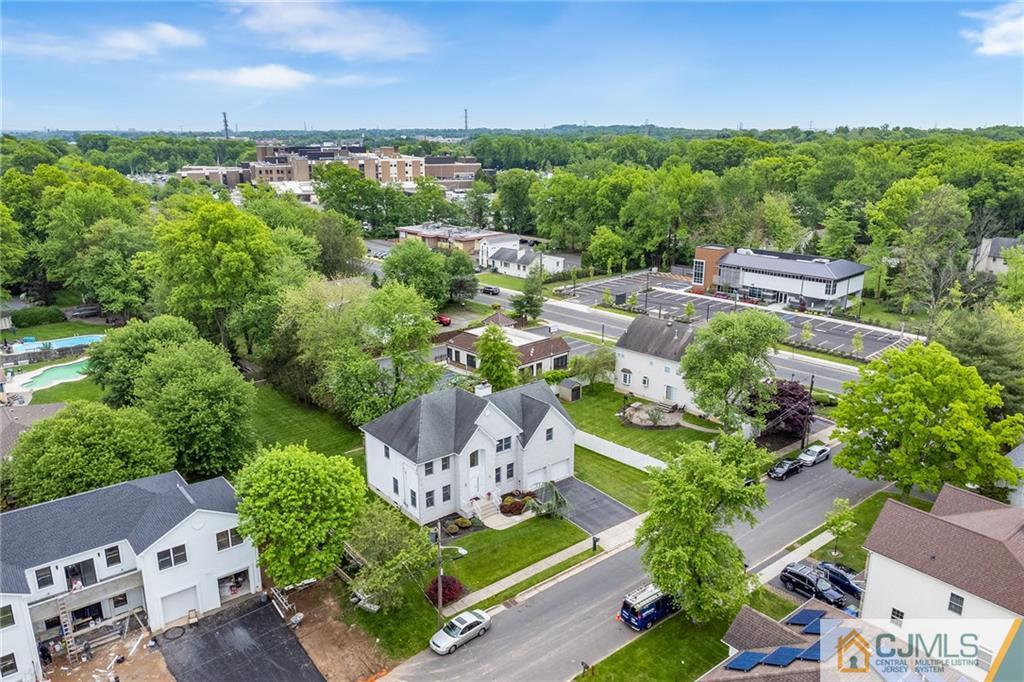 104 Mundy Avenue Edison, NJ 08820 - Photo 49 of 55 an aerial view of a city with lots of residential buildings green landscape and ocean view
