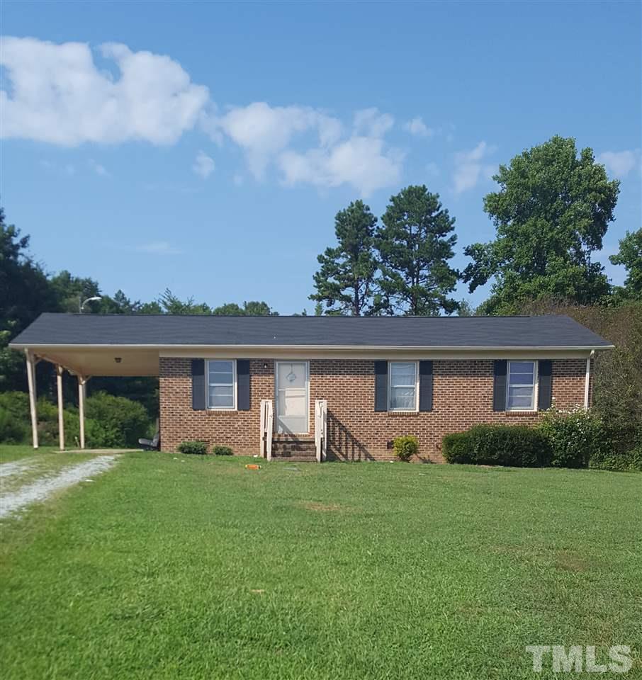 481 Todd Road Roxboro, NC 27574 - Photo 1 of 3 front view of house with a yard