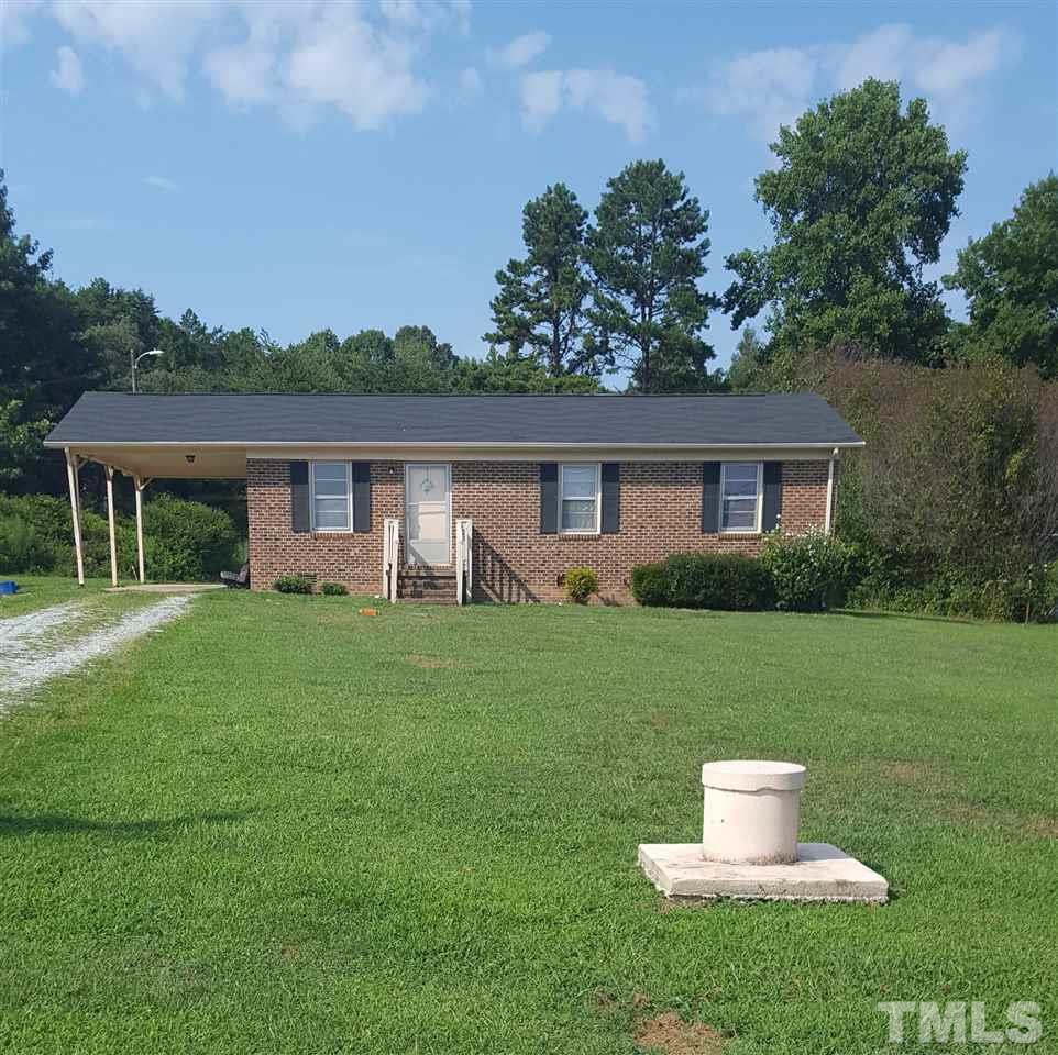 481 Todd Road Roxboro, NC 27574 - Photo 2 of 3 a front view of house with yard and green space