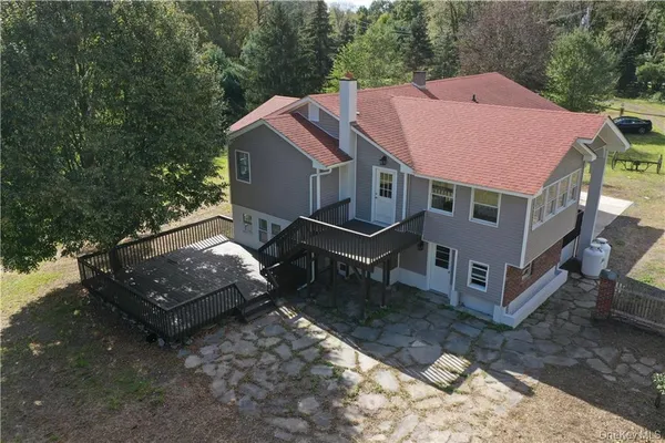 a aerial view of a house with a yard