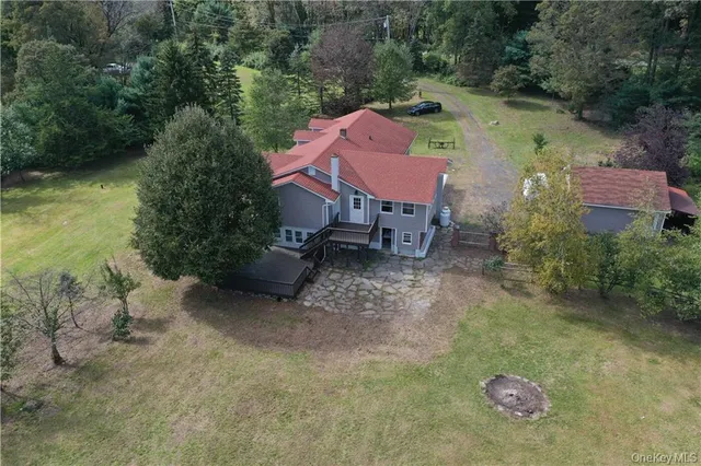 an aerial view of a house with outdoor space