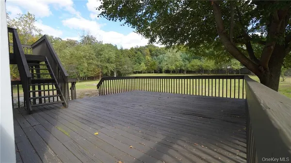 a view of a house with a wooden deck