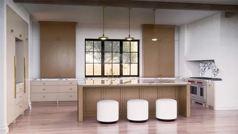 a kitchen with a sink cabinets and dining table chair