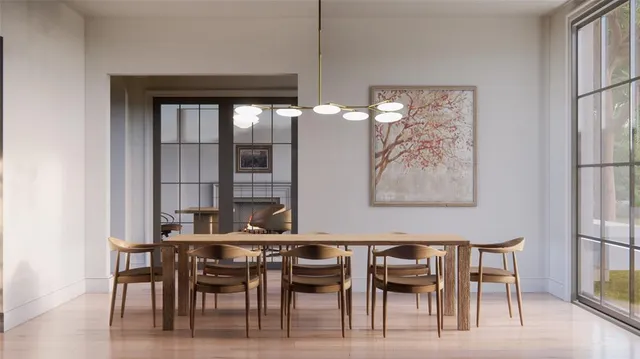 a view of a dining room with furniture and chandelier