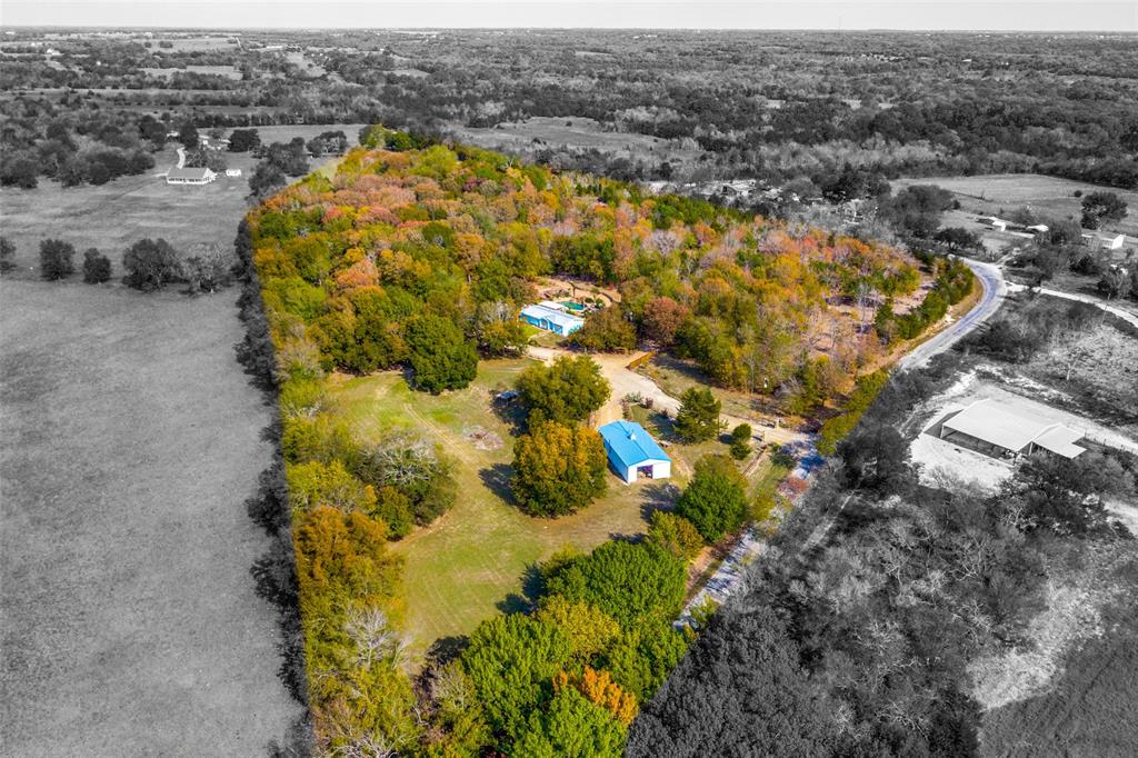 4939 Rose Hill Road Whitewright, TX 75491 - Photo 1 of 1 11.27 Acres, a Charming 3 Bedroom Home, Pool, Outdoor Shower, Workshop, Koi Pond, Tornado Shelter, Carport, RV Parking, Seasonal Pond, Electric Gate.
