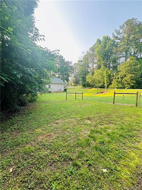 815 Poplar Street Monticello, GA 31064 - Photo 17 of 33 a view of an outdoor space and a yard